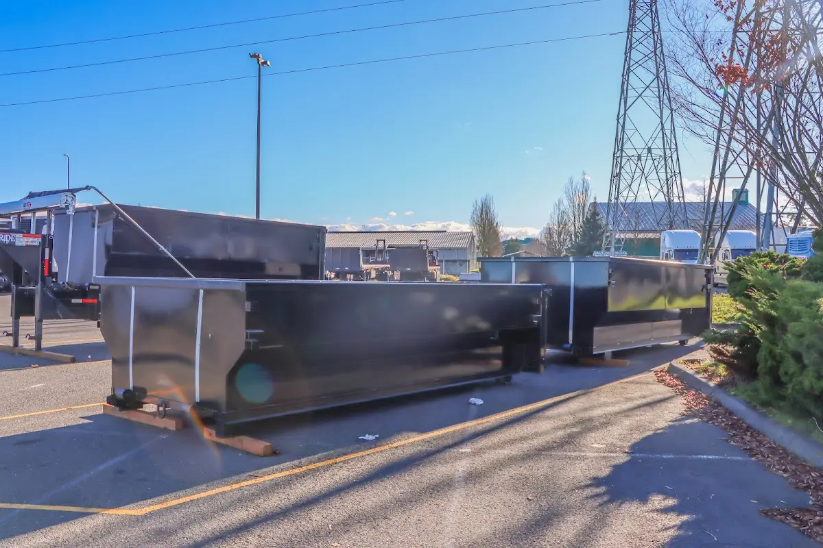 Roll-off dumpster ready for waste disposal at job site for 15 Yard Dumpster Rental in Fruitland